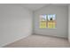 Bright bedroom with neutral walls and carpeted floors at 7565 Michelle Rd, Rocky Mount, NC 27803