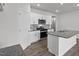 Modern kitchen with white cabinets, granite countertops, and stainless steel appliances at 7565 Michelle Rd, Rocky Mount, NC 27803