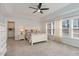 Bright bedroom with white bed frame and built-in dresser at 7572 Silver View Ln, Raleigh, NC 27613