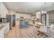 Modern kitchen with white cabinets, island, and breakfast nook at 7572 Silver View Ln, Raleigh, NC 27613