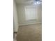 Bright bedroom featuring carpeted floors, natural light, and a ceiling fan at 814 Providence Glen Dr, Chapel Hill, NC 27514