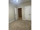 Neutral bedroom featuring carpeted floors, a ceiling fan, and a standard closet at 814 Providence Glen Dr, Chapel Hill, NC 27514