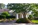 Inviting home exterior with manicured landscaping and covered entryway at 814 Providence Glen Dr, Chapel Hill, NC 27514