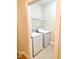 Practical laundry room with tile floors and modern washer and dryer at 814 Providence Glen Dr, Chapel Hill, NC 27514