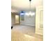 Living room features a ceiling fan, chandelier and fireplace at 814 Providence Glen Dr, Chapel Hill, NC 27514