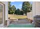 Private backyard with gravel patio and green space at 8352 Primanti Blvd, Raleigh, NC 27612