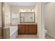Bathroom with double vanity, soaking tub, and separate shower at 8352 Primanti Blvd, Raleigh, NC 27612