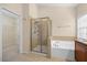 Bathroom with shower and tub, and walk-in closet at 8352 Primanti Blvd, Raleigh, NC 27612