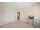 Spacious bedroom with double doors and glass desk at 8352 Primanti Blvd, Raleigh, NC 27612