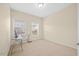Bright bedroom with carpet, neutral walls, and window at 8352 Primanti Blvd, Raleigh, NC 27612