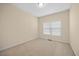 Simple bedroom with neutral walls and carpeted floor at 8352 Primanti Blvd, Raleigh, NC 27612