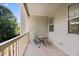 Private deck with wood flooring and small table at 8352 Primanti Blvd, Raleigh, NC 27612