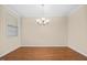 Bright dining room with hardwood floors and chandelier at 8352 Primanti Blvd, Raleigh, NC 27612
