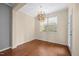 Bright dining room with hardwood floors and large window at 8352 Primanti Blvd, Raleigh, NC 27612