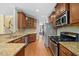 Modern kitchen with granite countertops and stainless steel appliances at 8352 Primanti Blvd, Raleigh, NC 27612