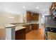 Kitchen features granite countertops, stainless steel appliances, and hardwood floors at 8352 Primanti Blvd, Raleigh, NC 27612