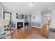 Spacious living room with hardwood floors, fireplace, and large windows at 8352 Primanti Blvd, Raleigh, NC 27612