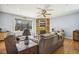 Living room with stone fireplace and wood floors at 8437 Charlie Stovall Rd, Oxford, NC 27565