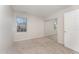 Bright bedroom featuring a mirrored closet and neutral carpeting at 9104 Colony Village Ln, Raleigh, NC 27617
