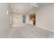 Open living room and kitchen with vaulted ceiling and carpet at 9104 Colony Village Ln, Raleigh, NC 27617