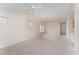 Bright living room with vaulted ceiling, carpet, and French doors at 9104 Colony Village Ln, Raleigh, NC 27617