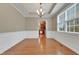 Elegant dining room with hardwood floors and view of kitchen at 924 Bentbury Way, Cary, NC 27518