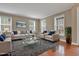 Spacious living room featuring hardwood floors, neutral walls, and ample natural light at 924 Bentbury Way, Cary, NC 27518