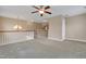 Spacious loft area with chandelier lighting and view of the stairwell at 924 Bentbury Way, Cary, NC 27518