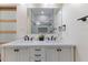 Modern bathroom boasts double vanity, large mirror, and marble accents at 1007 N King Ave, Dunn, NC 28334
