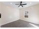 Spacious bedroom with ceiling fan and neutral carpeting at 1007 N King Ave, Dunn, NC 28334