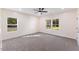 Bright bedroom with two windows and ceiling fan at 1007 N King Ave, Dunn, NC 28334