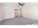 Bedroom with barn door and neutral carpet at 1007 N King Ave, Dunn, NC 28334