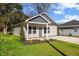 Charming new construction home with gray accents, landscaping, and a paved driveway at 1007 N King Ave, Dunn, NC 28334