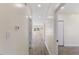 Bright hallway with light grey laminate flooring, leading to other rooms at 1007 N King Ave, Dunn, NC 28334