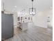 Open concept kitchen features a large island and light-toned flooring at 1007 N King Ave, Dunn, NC 28334