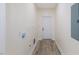 Bright laundry room with neutral walls and vinyl flooring at 1007 N King Ave, Dunn, NC 28334