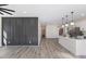 Open living area with modern wall accents, hardwood floors and ceiling fan at 1007 N King Ave, Dunn, NC 28334