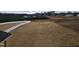 Large backyard with a white privacy fence and distant view of houses at 1013 Prominence Dr., Homesite 22, Durham, NC 27712