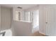 Upstairs hallway with doors to bedrooms and bathroom at 103 Scoville St, Oxford, NC 27565