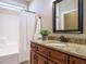 Bathroom with granite countertop vanity and a shower/tub combo at 116 Telluride Trl, Garner, NC 27529