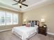 Main bedroom with a ceiling fan and large windows at 116 Telluride Trl, Garner, NC 27529