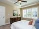 Bedroom featuring a dresser and large window with shutters at 116 Telluride Trl, Garner, NC 27529