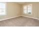 Bright bedroom with neutral walls and carpet flooring at 116 Telluride Trl, Garner, NC 27529