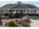 Community clubhouse back exterior view with covered patio and landscaping at 116 Telluride Trl, Garner, NC 27529