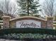 The Tapestry community entrance sign; stone structure with landscaping at 116 Telluride Trl, Garner, NC 27529