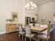Bright dining room with hardwood floors and a large wooden table at 116 Telluride Trl, Garner, NC 27529