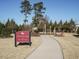 Birdhouse park and Rover's Run, a pathway leads through a grassy dog park area at 116 Telluride Trl, Garner, NC 27529