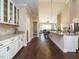 Spacious kitchen with island, stainless steel appliances, and hardwood floors at 116 Telluride Trl, Garner, NC 27529