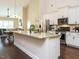 Modern kitchen with white cabinets, granite countertops, and stainless steel appliances at 116 Telluride Trl, Garner, NC 27529