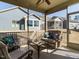 Relaxing screened porch with wicker furniture and backyard view at 116 Telluride Trl, Garner, NC 27529